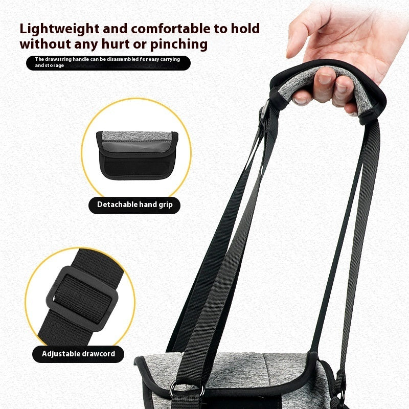 Hand holding the padded strap on a pet harness