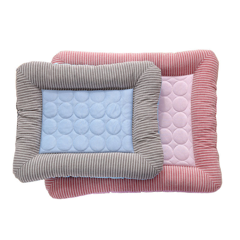 gray pet bed with striped border on top of larger pink pet bed with striped border