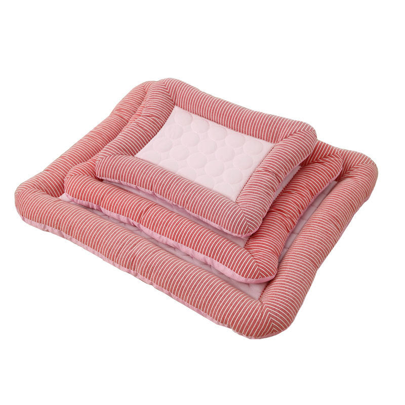 Stack of three different size pink pet beds with striped edging