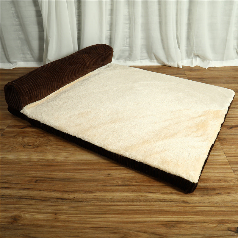 Corduroy dog bed with brown exterior and beige interior and cushion on one side on a wooden floor.