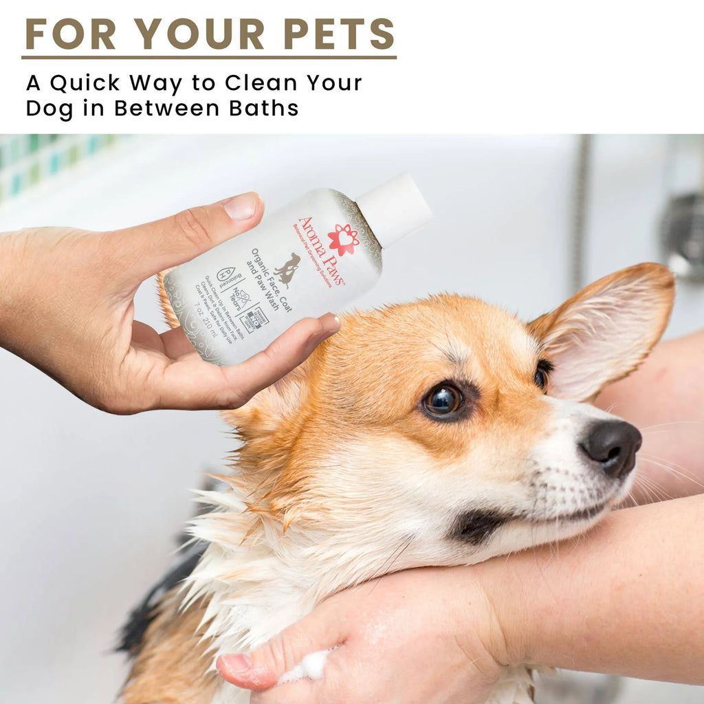 Person applying Aroma Paws Face, Coat, and Paw Wash to a dog with text about cleaning pets between baths.
