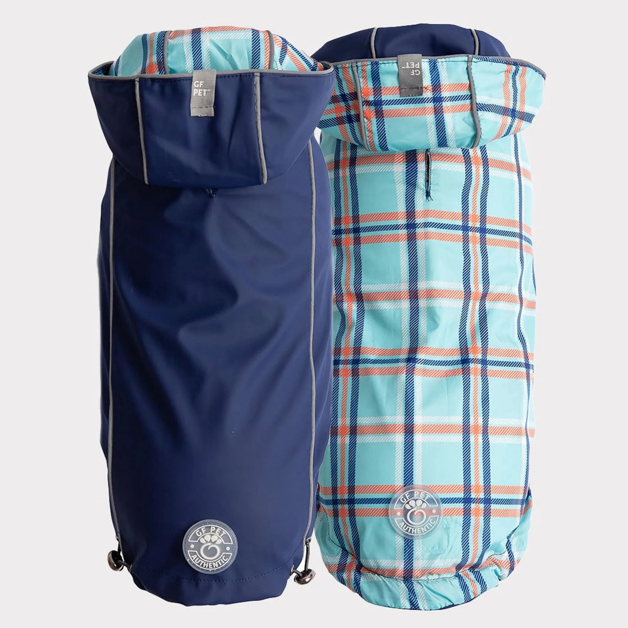 Two pet raincoats, one blue and one blue plaid