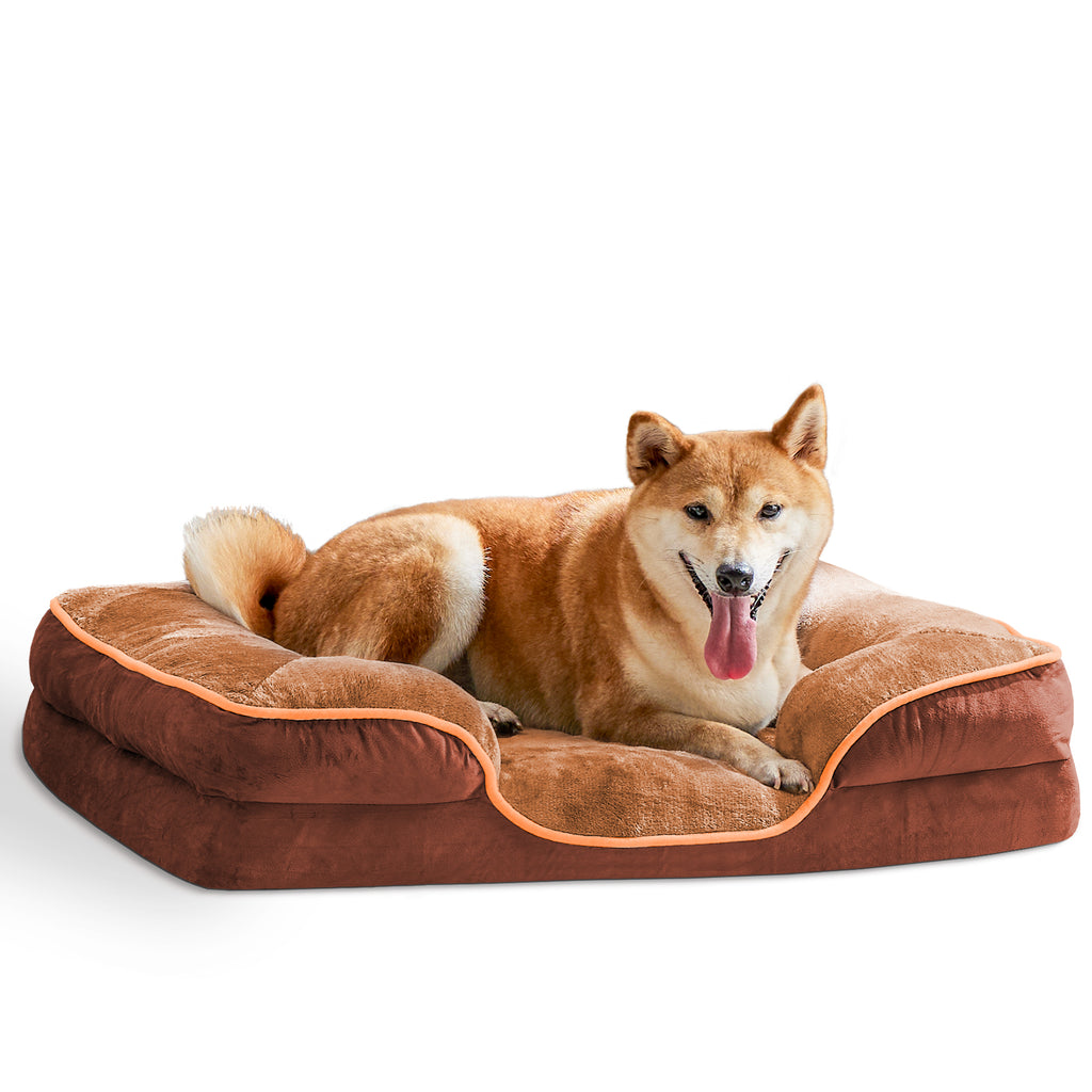 Dog lying on a brown pet bed