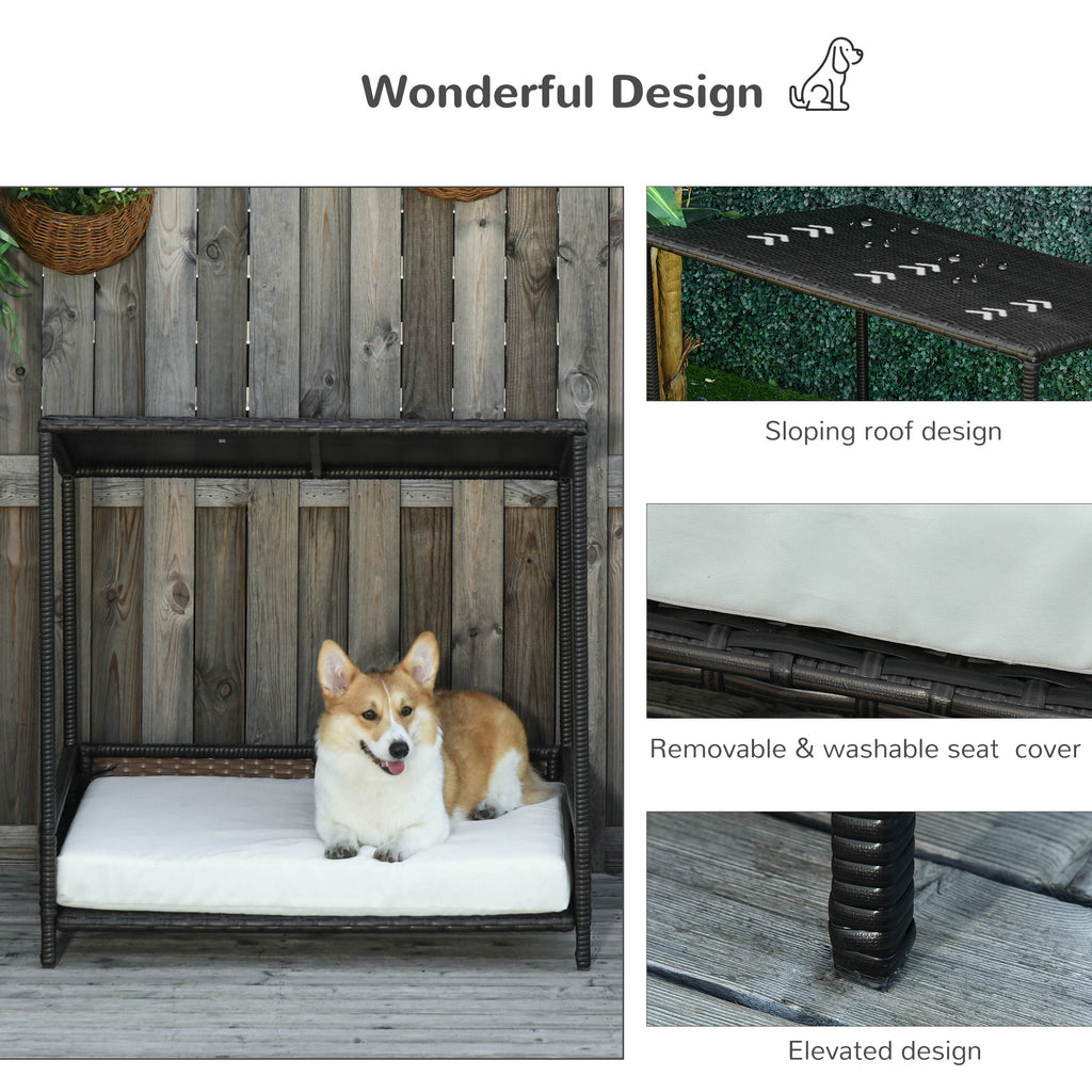 Dog bed with sloping roof, removable cover, and elevated design on a wooden deck.