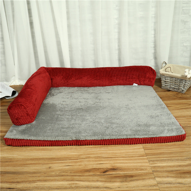 Corduroy red and grey pet bed with two sides enclosed on wooden floor